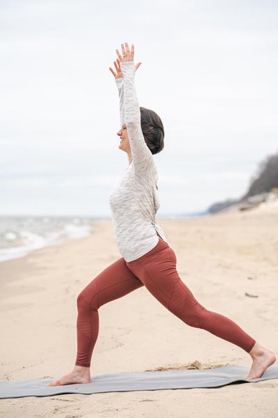 Yoga teacher Carli Watson in yoga pose of somatic yoga for emotional release